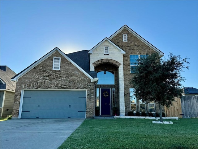 view of front of home with a garage and a front lawn