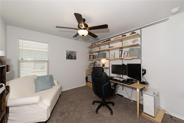 carpeted office space with ceiling fan