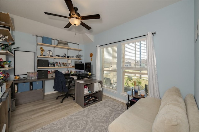 office area with a ceiling fan and wood finished floors