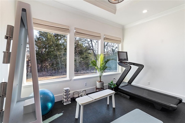 workout area featuring baseboards, recessed lighting, and crown molding