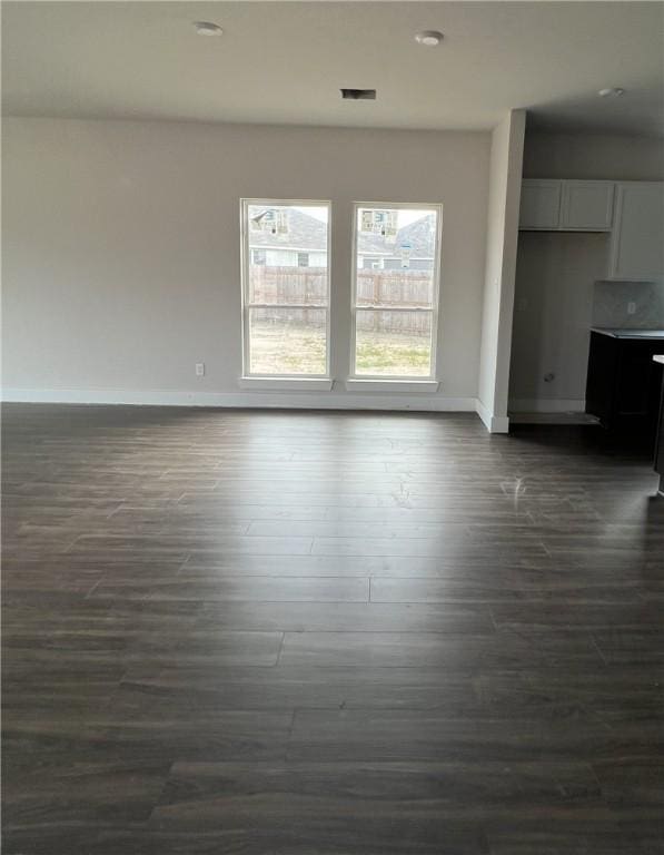 5324 Lyle Pl, Bryan, TX 77807 - unfurnished living room featuring dark wood-style floors and recessed lighting
