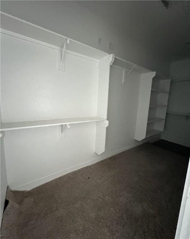 5324 Lyle Pl, Bryan, TX 77807 - walk in closet featuring dark carpet