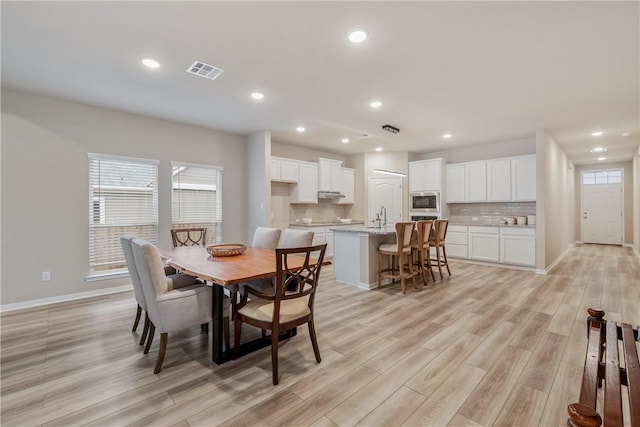 5324 Lyle Pl, Bryan, TX 77807 - dining room featuring light wood-style flooring, baseboards, and recessed lighting