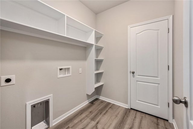 5324 Lyle Pl, Bryan, TX 77807 - laundry room featuring hookup for an electric dryer, wood finished floors, hookup for a washing machine, and baseboards