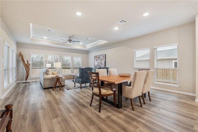 5324 Lyle Pl, Bryan, TX 77807 - dining room with a raised ceiling, light wood finished floors, baseboards, a ceiling fan, and recessed lighting