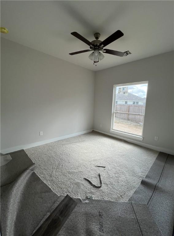 5324 Lyle Pl, Bryan, TX 77807 - carpeted empty room with baseboards and ceiling fan