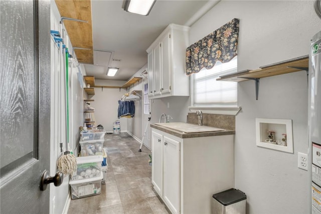 kitchen featuring tile countertops, white cabinetry, and light tile patterned floors