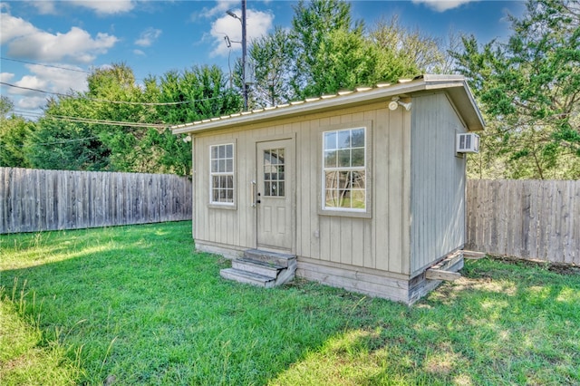 view of outbuilding featuring a yard