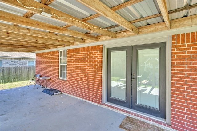 property entrance featuring french doors and a patio