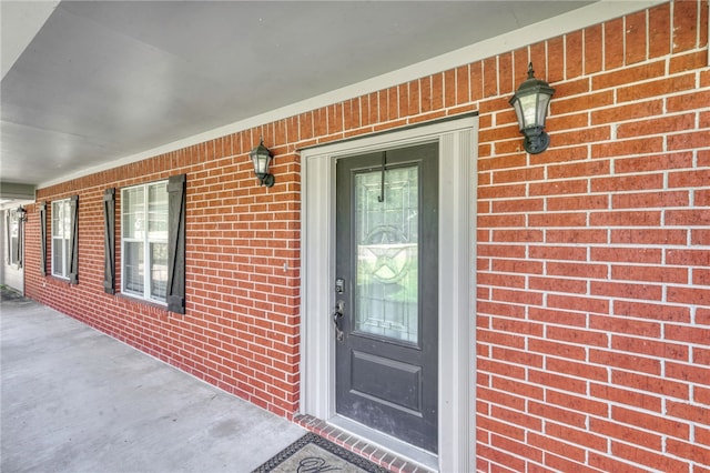 doorway to property with a porch