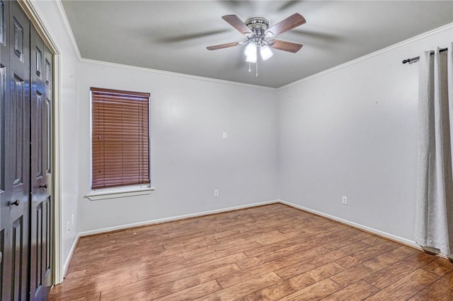 unfurnished bedroom with hardwood / wood-style floors, ceiling fan, and ornamental molding