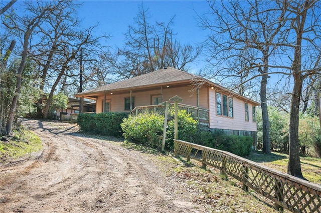 view of side of property featuring driveway