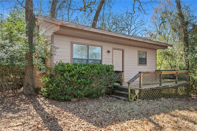 exterior space featuring a wooden deck