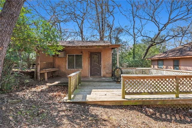 wooden deck with an outdoor structure