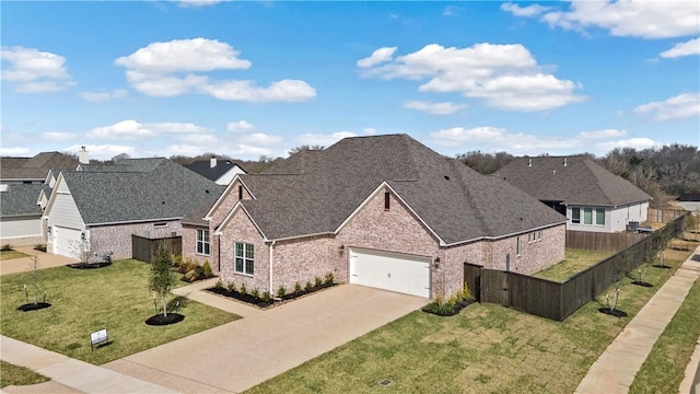 view of front of property with a garage and a front lawn