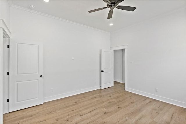 empty room with crown molding, ceiling fan, and light hardwood / wood-style floors