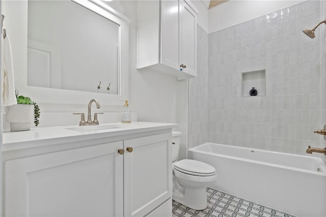 full bathroom with vanity, toilet, and tiled shower / bath combo