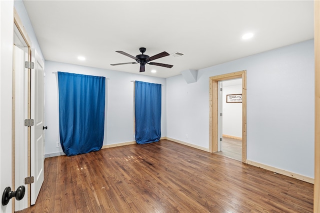 unfurnished room with hardwood / wood-style flooring and ceiling fan