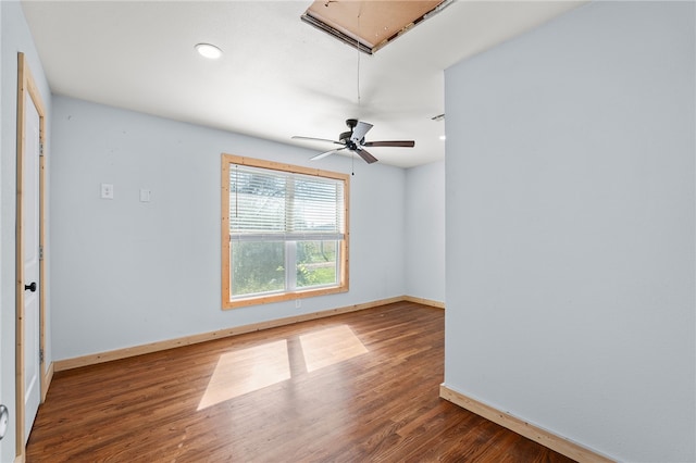 empty room with hardwood / wood-style floors and ceiling fan