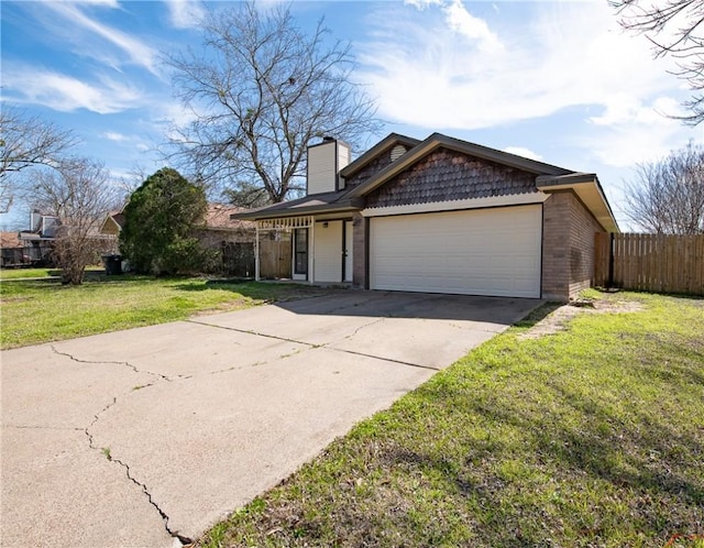 view of front of property with a front lawn, driveway, an attached garage, and fence