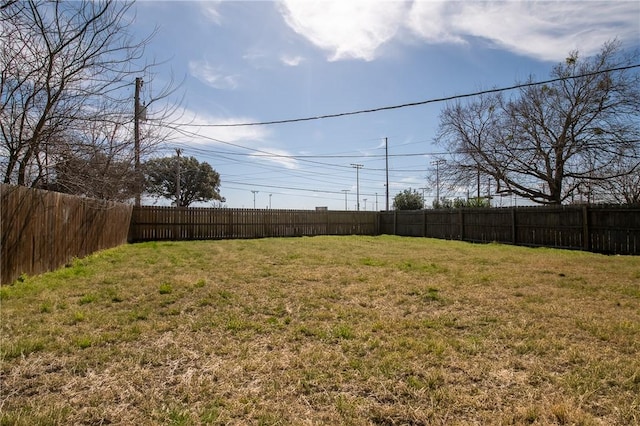 view of yard with a fenced backyard