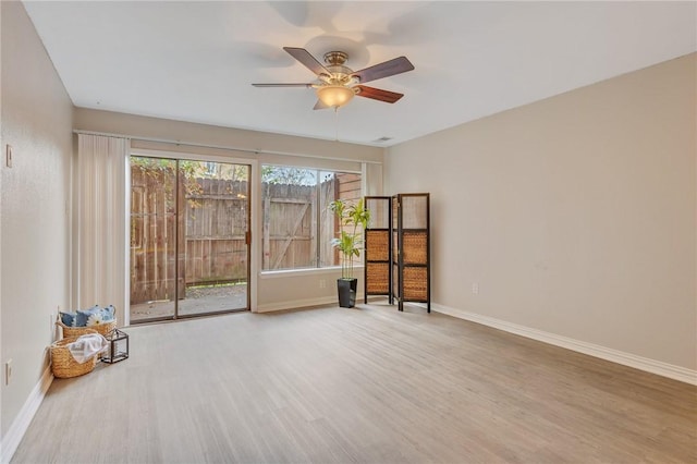 empty room featuring ceiling fan and wood-type flooring