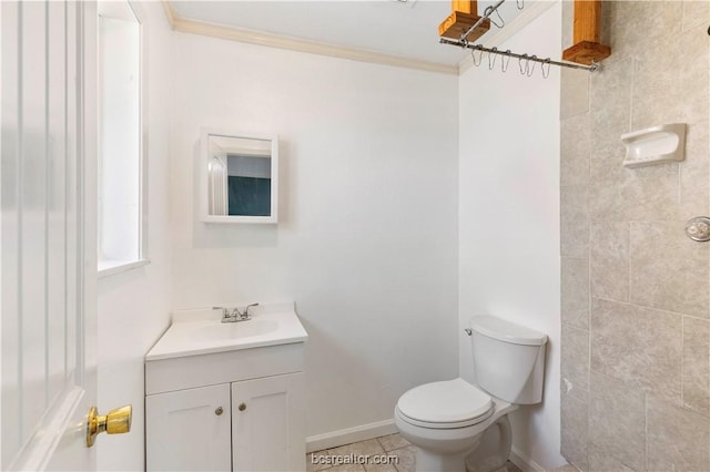 bathroom featuring tile patterned flooring, vanity, and toilet