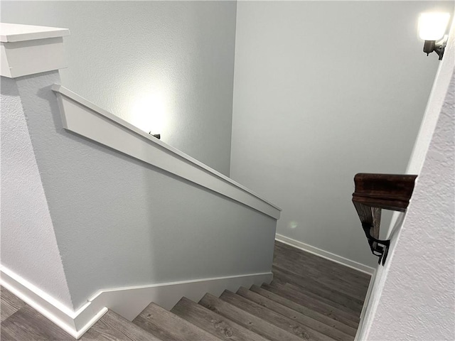 staircase featuring hardwood / wood-style flooring