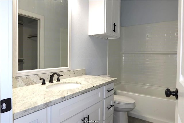 full bathroom with shower / bathing tub combination, vanity, and toilet