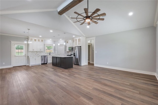 1410 Rochester St, Bryan, TX 77803 - unfurnished living room with a ceiling fan, dark wood finished floors, a chandelier, and recessed lighting
