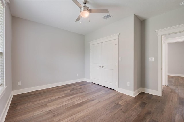 1410 Rochester St, Bryan, TX 77803 - unfurnished bedroom with wood finished floors, a ceiling fan, and a closet