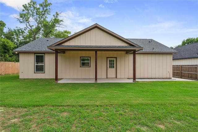 1410 Rochester St, Bryan, TX 77803 - back of property featuring a patio area, a fenced backyard, and a shingled roof