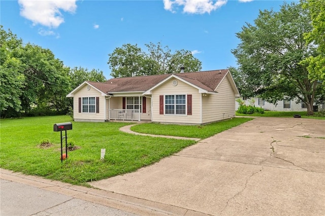 ranch-style house with a porch and a front yard