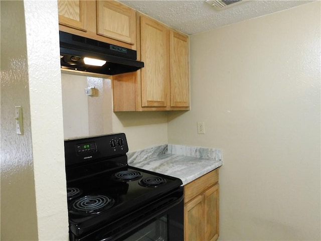 kitchen with light brown cabinets, a textured ceiling, and black / electric stove