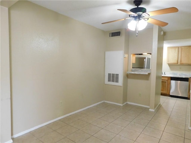 kitchen featuring ceiling fan, light tile patterned flooring, and stainless steel appliances