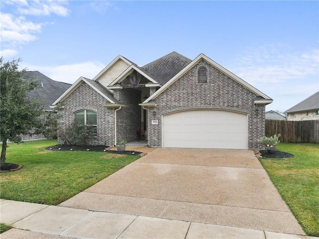 view of front facade with a front yard and a garage