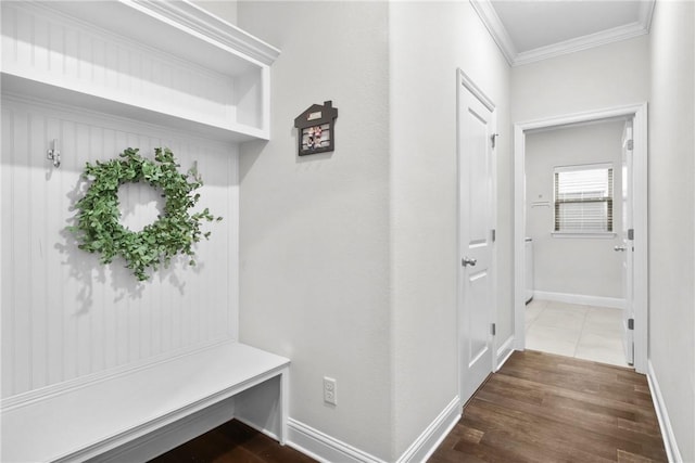 mudroom featuring dark hardwood / wood-style floors and crown molding