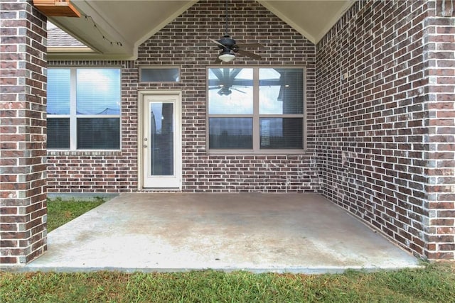 property entrance featuring ceiling fan and a patio