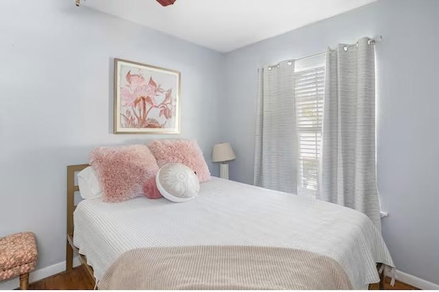 318 Kyle Ave, College Station, TX 77840 - bedroom featuring baseboards, wood finished floors, and ceiling fan
