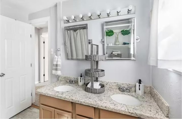 318 Kyle Ave, College Station, TX 77840 - full bathroom featuring double vanity and tile patterned flooring