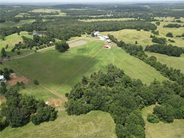 birds eye view of property featuring a rural view