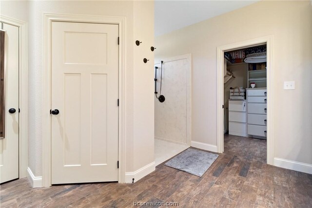 corridor with dark wood-type flooring