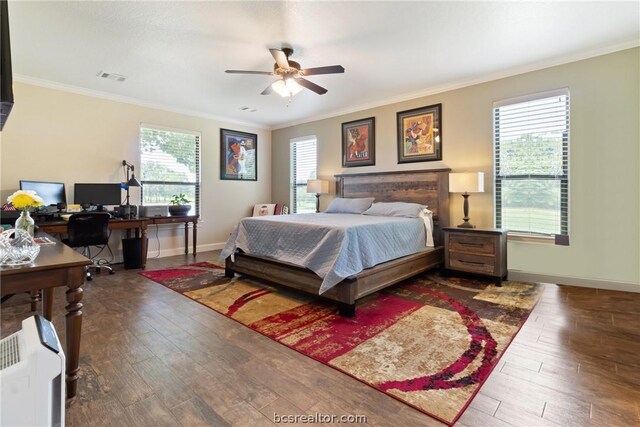 bedroom featuring hardwood / wood-style flooring, ceiling fan, ornamental molding, and multiple windows