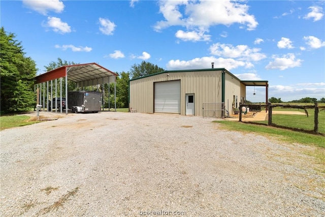 exterior space with a garage and a carport