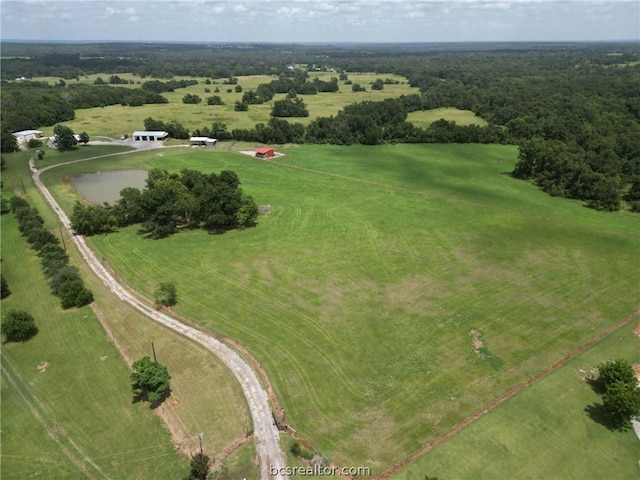 drone / aerial view featuring a rural view and a water view