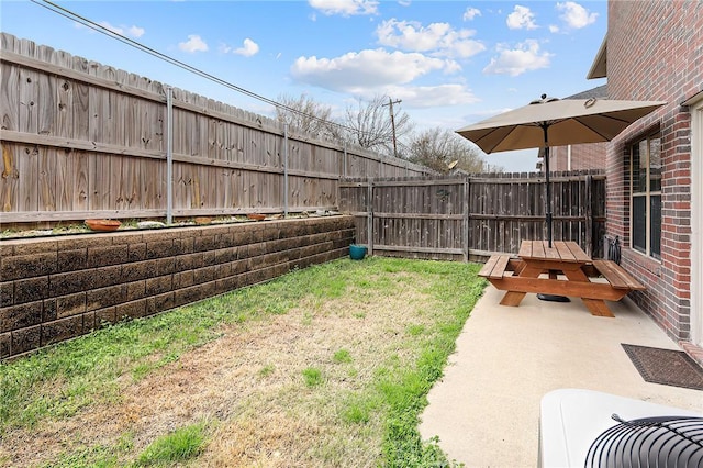 view of yard featuring a patio and central AC