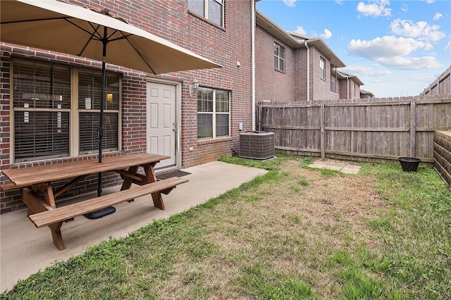 view of yard featuring a patio area and central AC