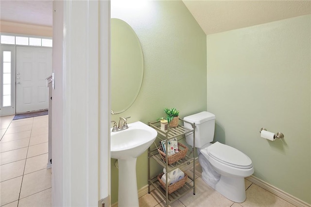 bathroom featuring sink, tile patterned flooring, and toilet