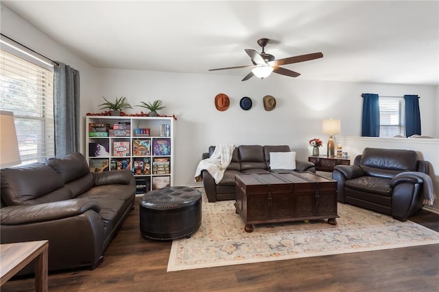 living room with wood finished floors and ceiling fan