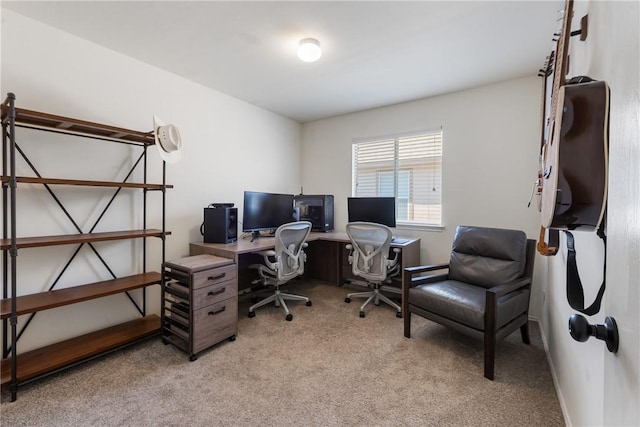 home office with light colored carpet and baseboards